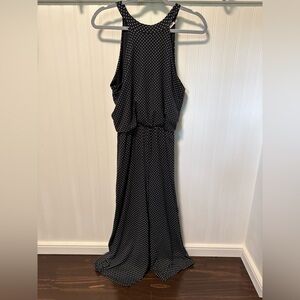 Rolla Coster Black Halter One-piece jumpsuit with white polka dots.